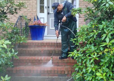 Man power washing steps